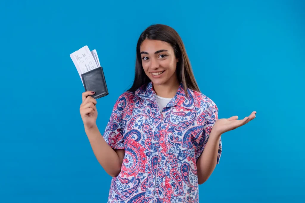 Lady holding passport and tickets